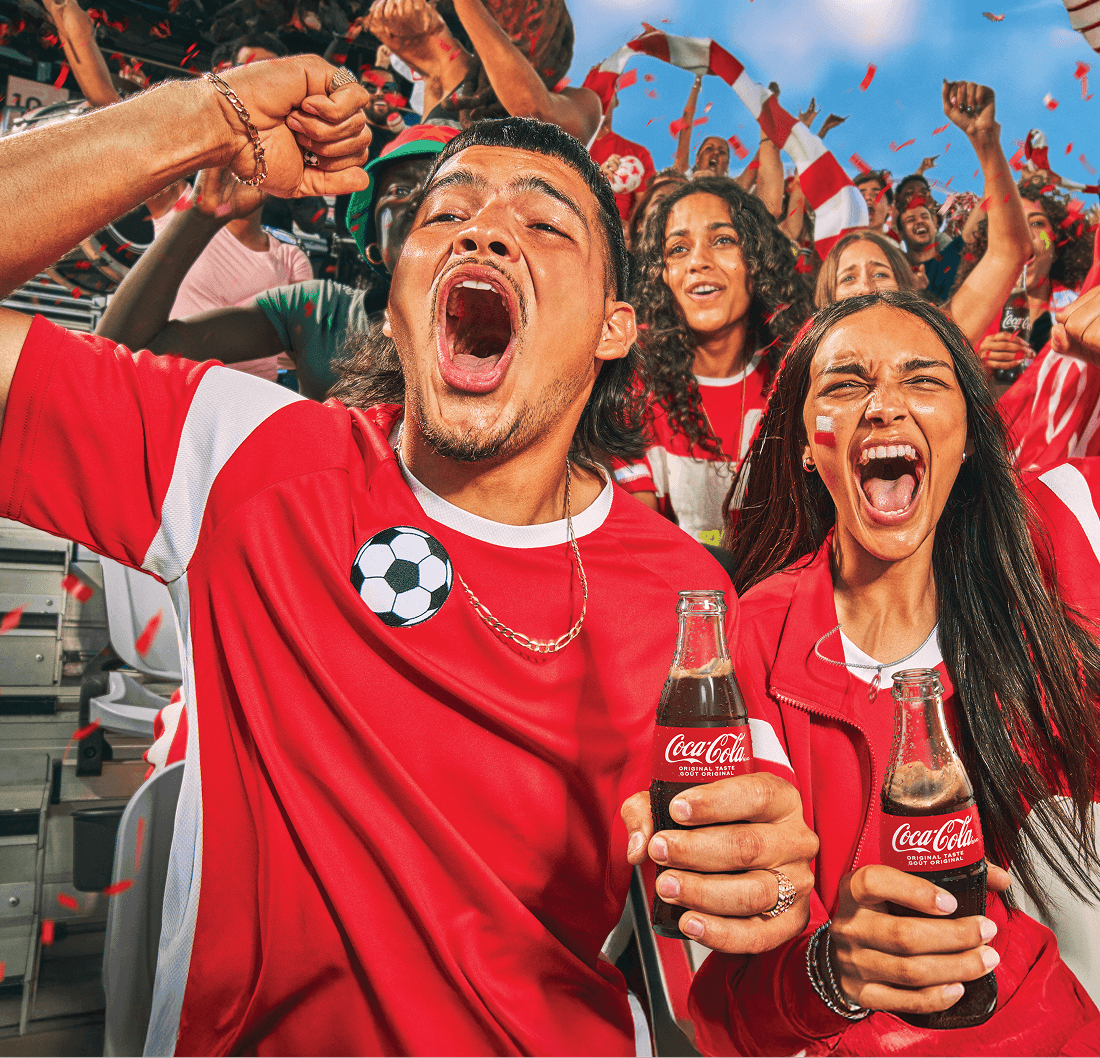 Two people with Coca-Cola® bottles