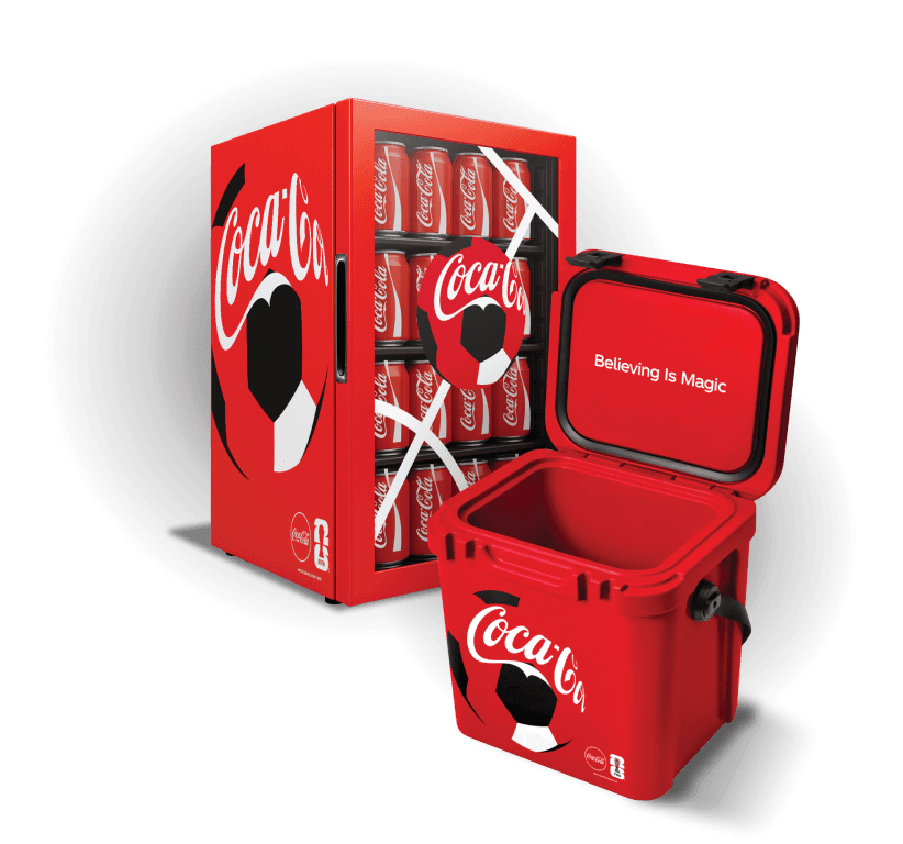 Coca-Cola® mini fridge and cooler. The cooler lid reads 'Believing Is Magic.'
